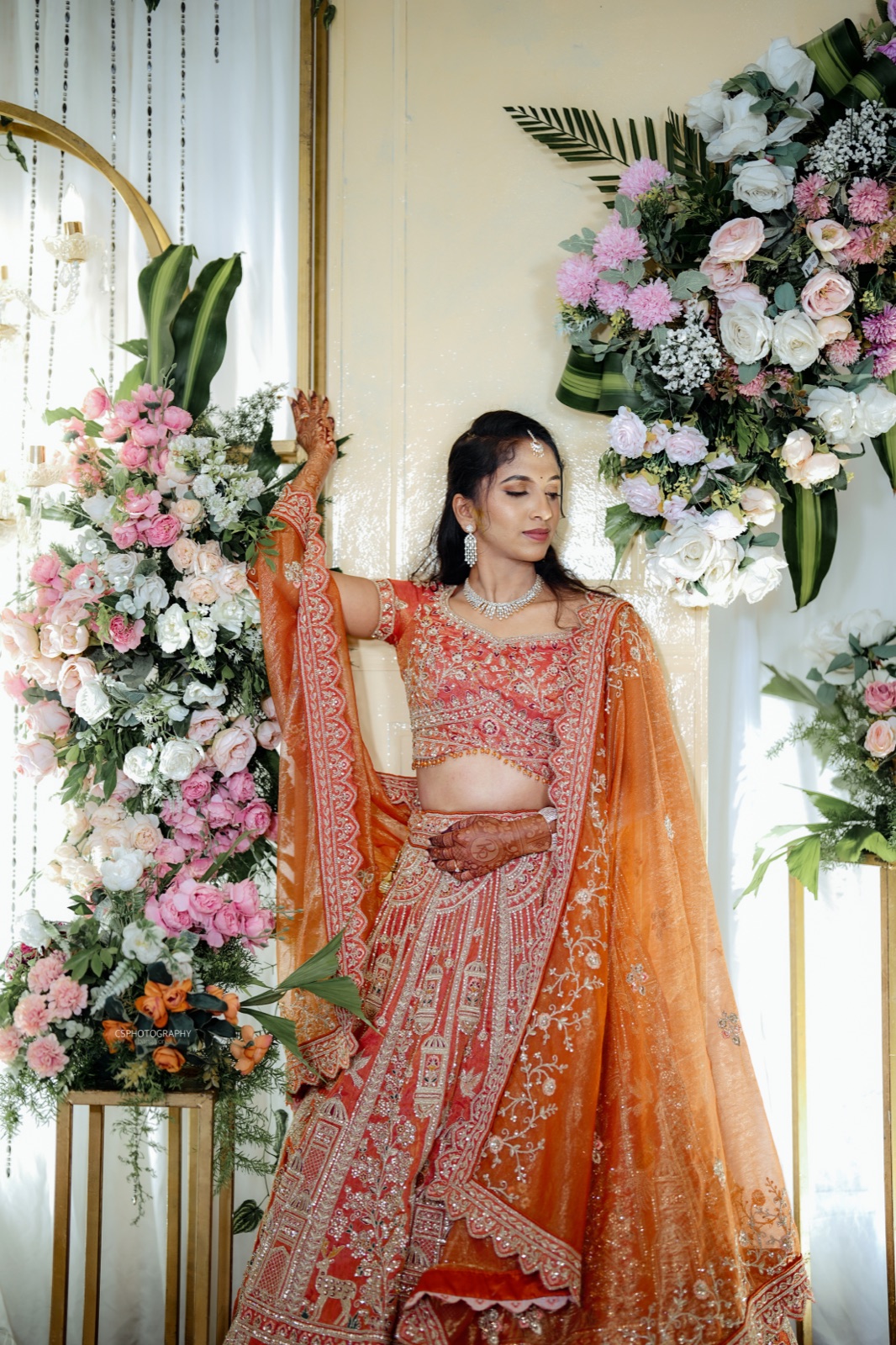 Pooja in a full-length portrait